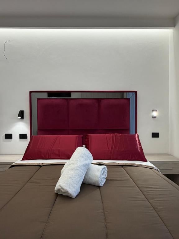 Ένα ή περισσότερα κρεβάτια σε δωμάτιο στο D'ANNUNZIO suites