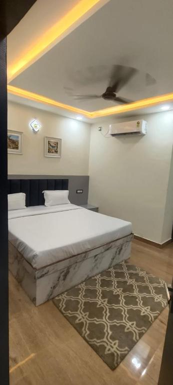 a bedroom with a large bed with a ceiling at The Prahas resort in Dabra