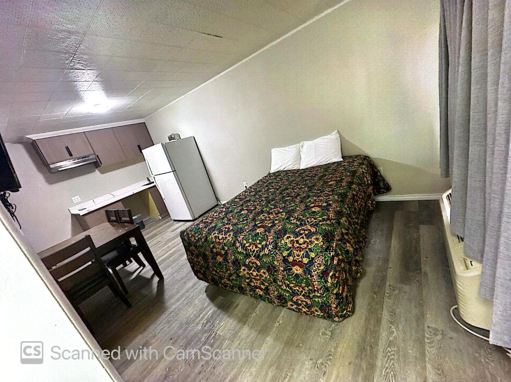 Ένα ή περισσότερα κρεβάτια σε δωμάτιο στο windmill inn lynden