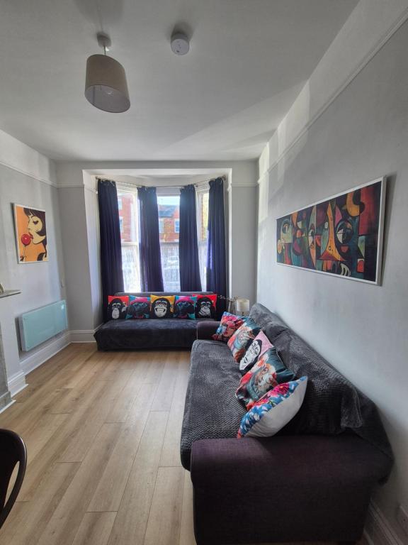 a living room with a couch and two couches at Dover Heights in Dover