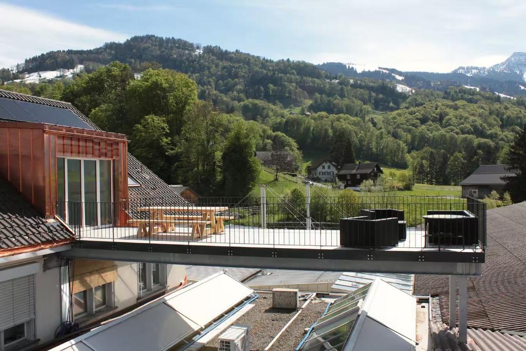a balcony of a house with a view of a mountain at Fuchs at home in Kaltbrunn