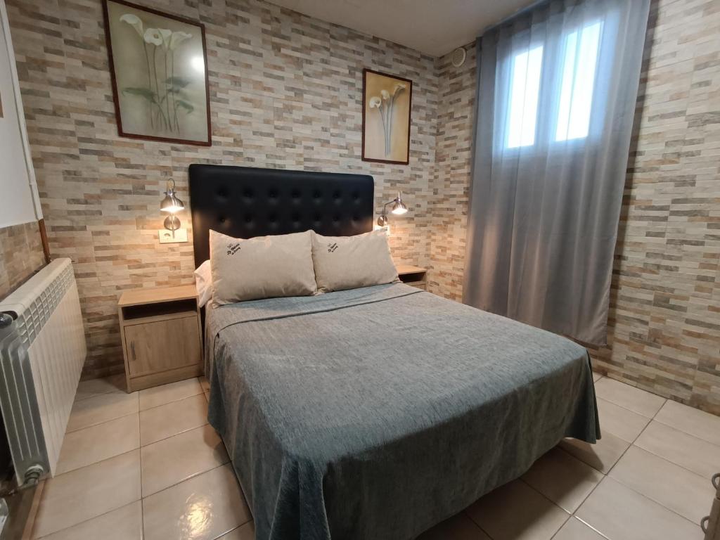 Postel nebo postele na pokoji v ubytování ESTUDIO FAMILIAR En EZCARAY