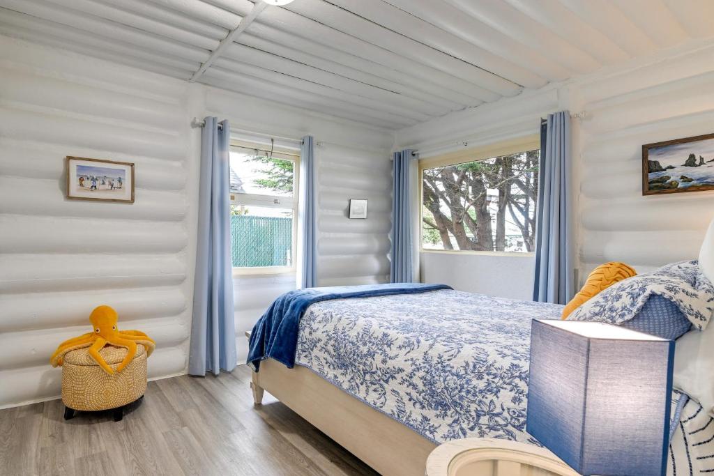 a bedroom with a bed and a window at Unique Dog-Friendly Log Cabin Short Walk to Ocean in Crescent City