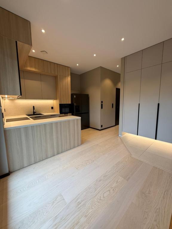 Η κουζίνα ή μικρή κουζίνα στο Modern apartment near Gardermoent airport