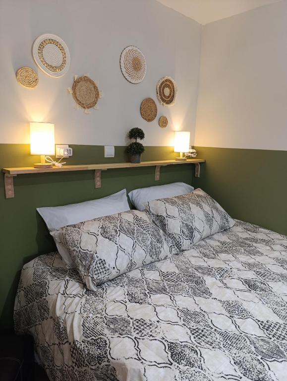 a bedroom with a bed with two pillows on it at Studio 35 - Modern & Cozy Studio in Chalandri City Center in Athens