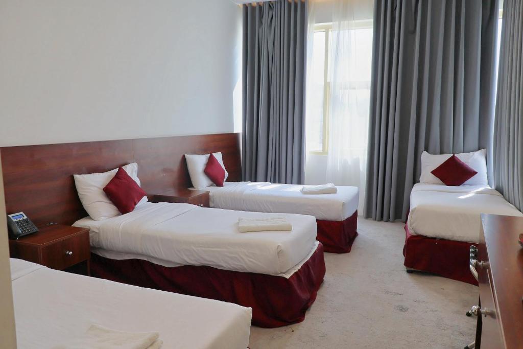 Postel nebo postele na pokoji v ubytování فندق الاصول