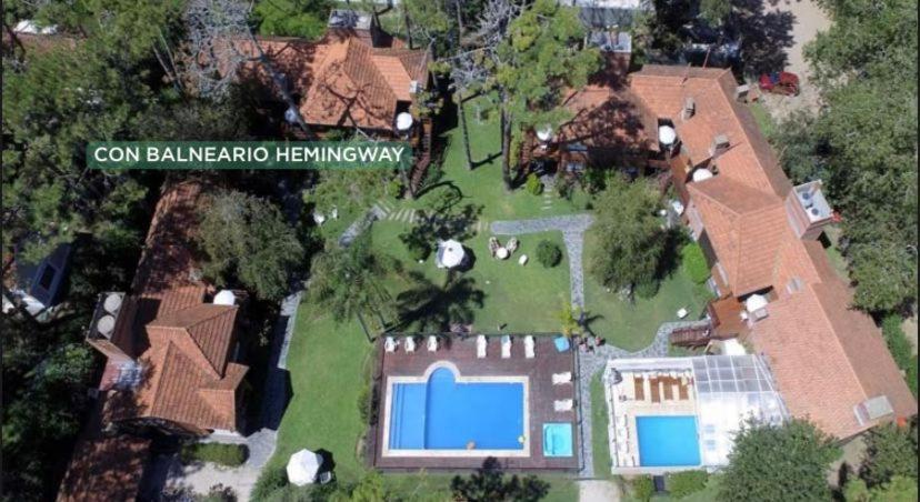 an aerial view of a house with a swimming pool at La Posta de Cariló in Carilo