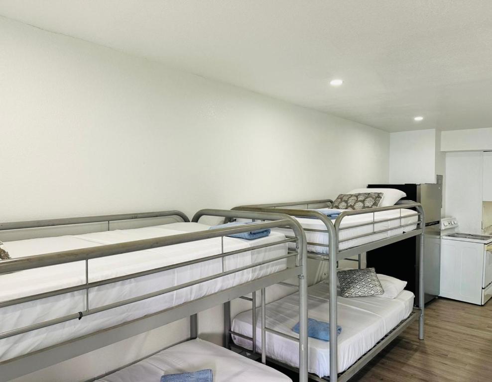 a room with two bunk beds and a kitchen at Casa Miami in Miami