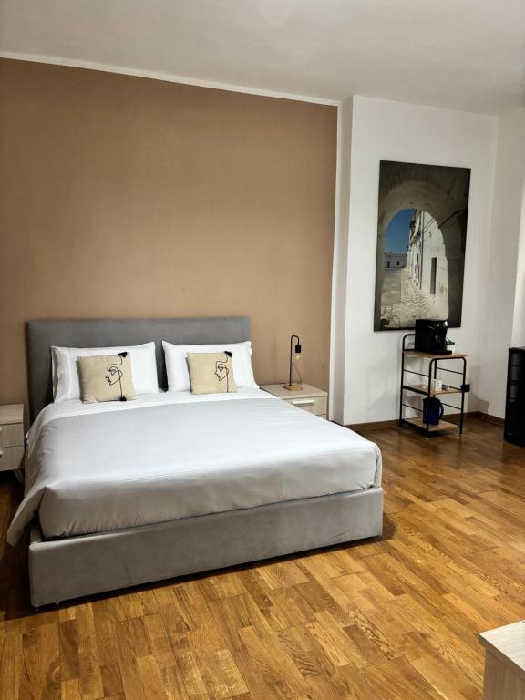 Ένα ή περισσότερα κρεβάτια σε δωμάτιο στο Lo Re City rooms