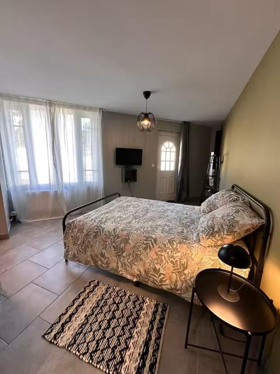 Postel nebo postele na pokoji v ubytování Le studio