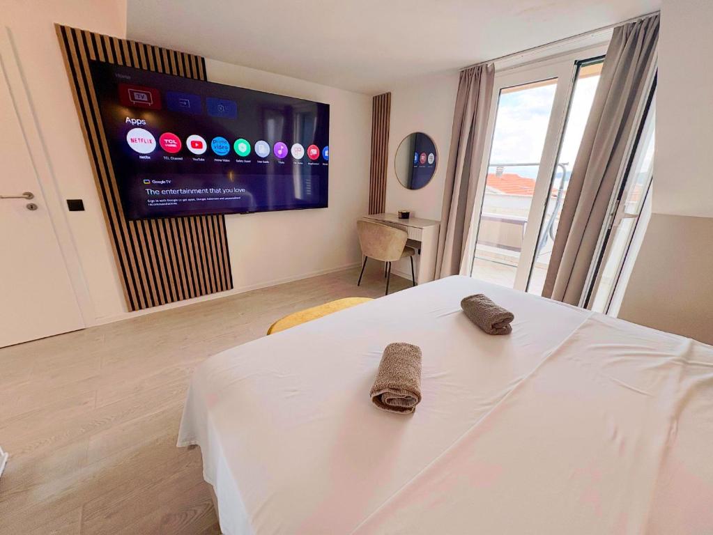 Giường trong phòng chung tại Apartment Anchor Luxury