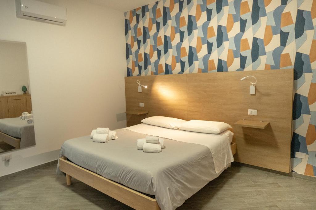 Postel nebo postele na pokoji v ubytování Appartamento completo parcheggio privato - Villa Ciaculli