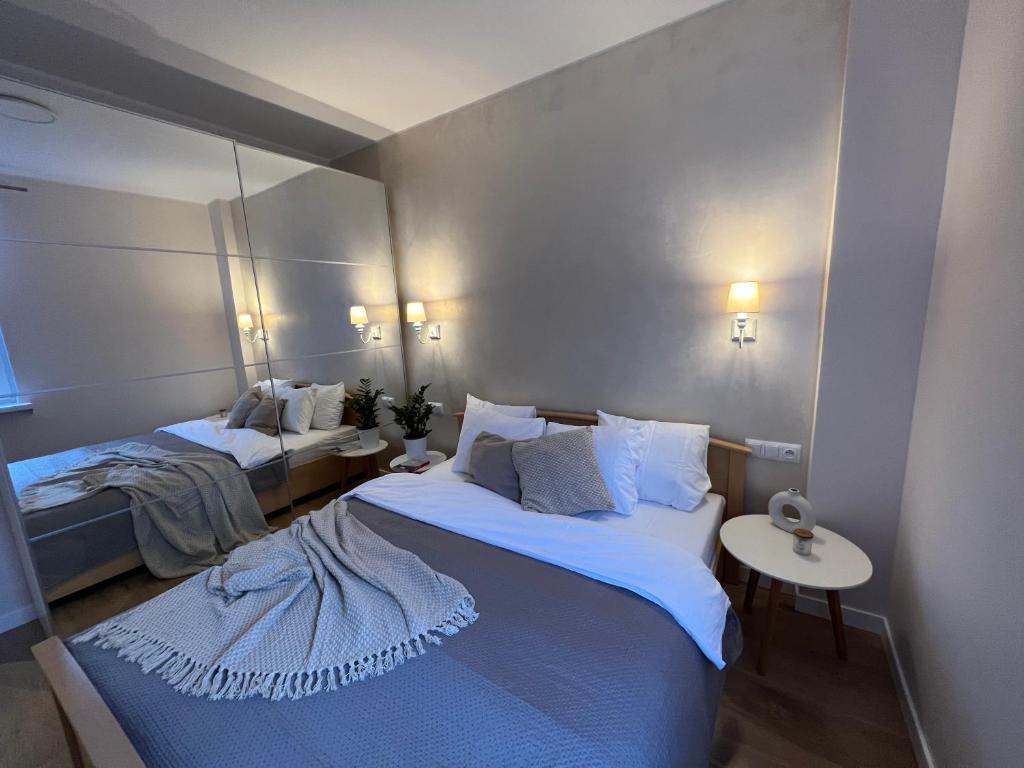 Postel nebo postele na pokoji v ubytování Cosy Guest Apartment Gdynia