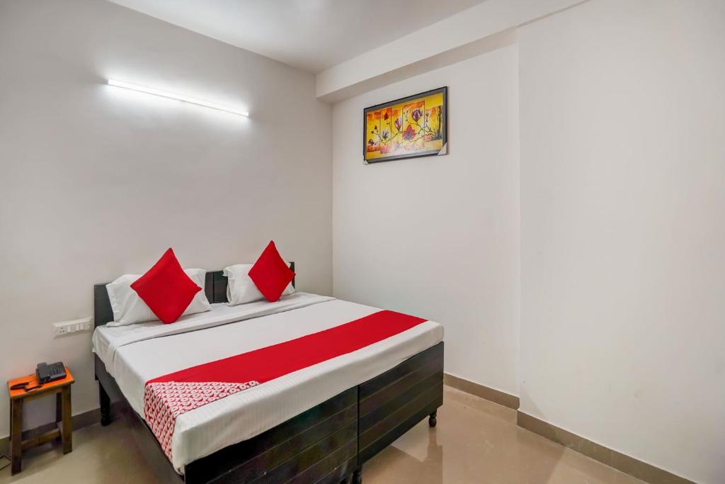 Ένα ή περισσότερα κρεβάτια σε δωμάτιο στο Hotel O PubG Residency