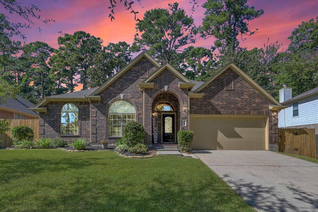 a brick house with a driveway at Aspen Drive in Montgomery
