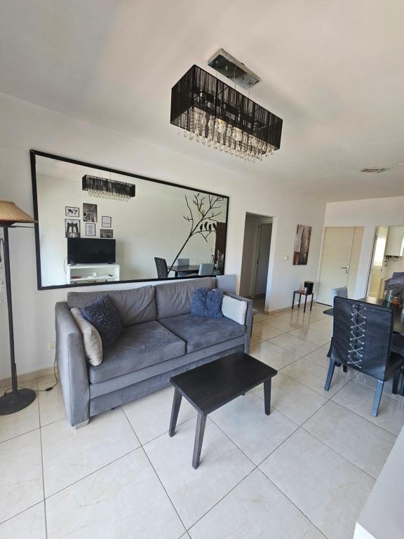 a living room with a couch and a table at PALERMO APART 1 in Buenos Aires