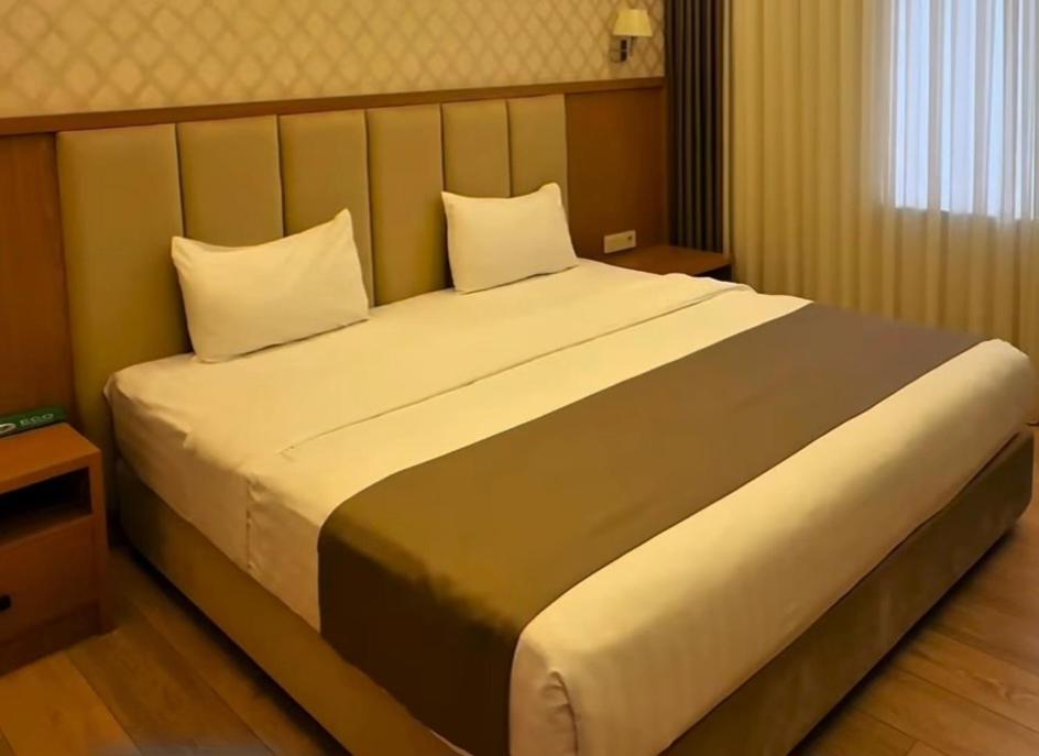 Voodi või voodid majutusasutuse Royal Garden toas