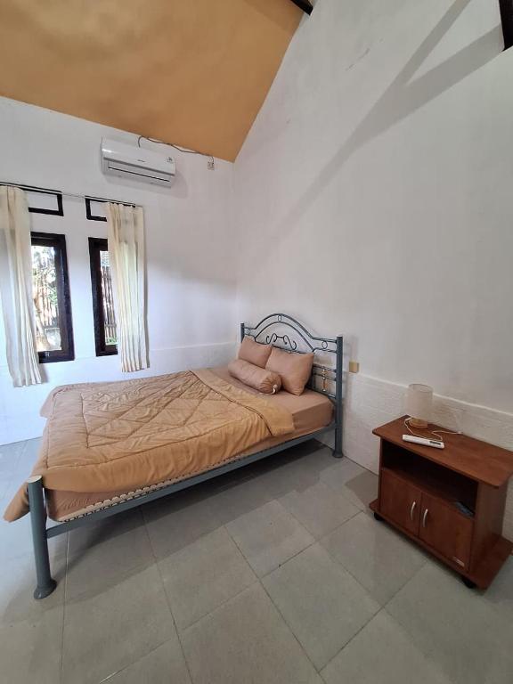 Postel nebo postele na pokoji v ubytování La Calma House