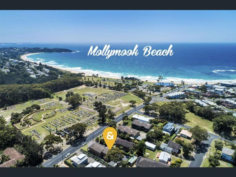 an aerial view of a beach with a resort at Mollymook Beach getaway in Mollymook