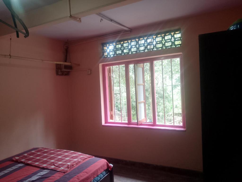 Ένα ή περισσότερα κρεβάτια σε δωμάτιο στο Sehandi Hotel - Arachchi Gedara