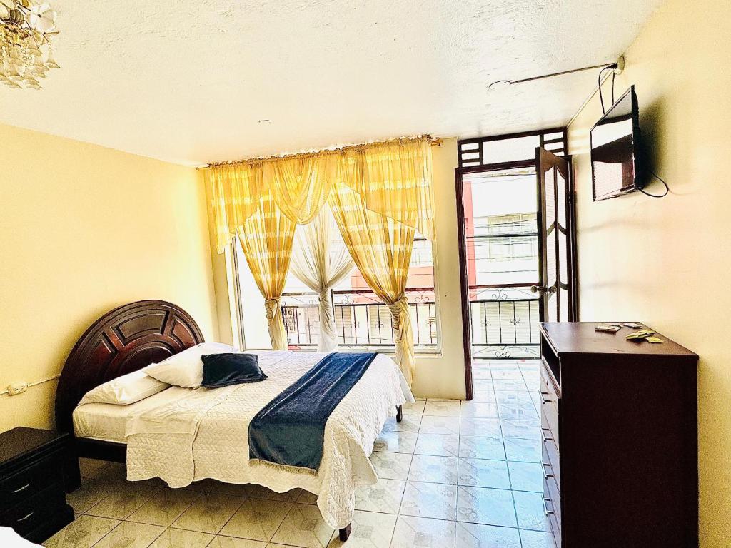 Postel nebo postele na pokoji v ubytování Hostal Copacabanna