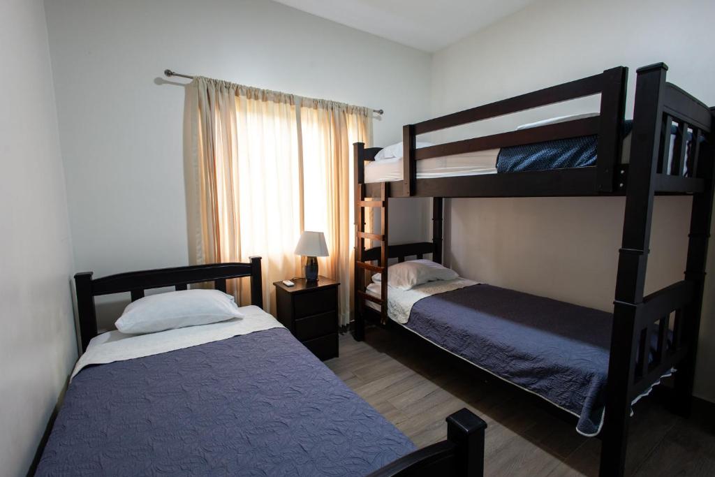 Postel nebo postele na pokoji v ubytování Casa en puntaleona Condomio Bambu