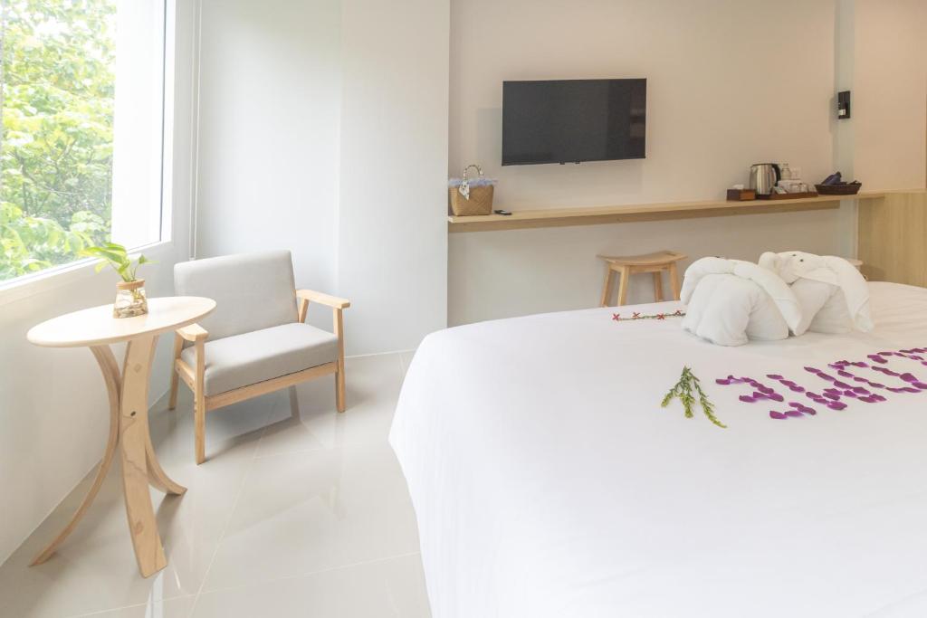 Ένα ή περισσότερα κρεβάτια σε δωμάτιο στο Ao Nang CheapPer Hotel