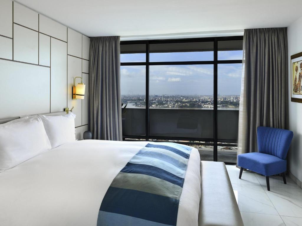 Ένα ή περισσότερα κρεβάτια σε δωμάτιο στο Sofitel Abidjan Hotel Ivoire