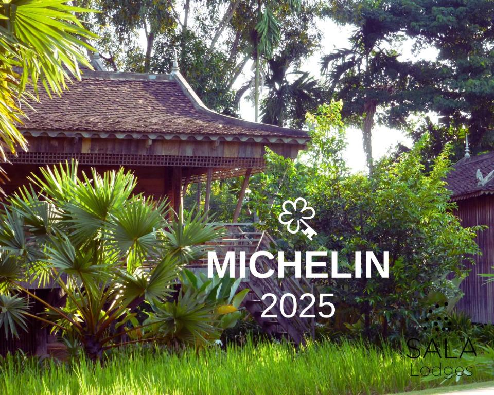 a sign that says mulitzin in front of a house at Sala Lodges in Siem Reap