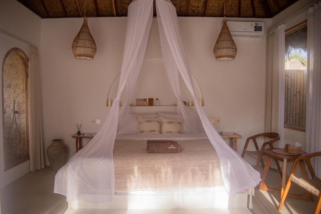 Ένα ή περισσότερα κρεβάτια σε δωμάτιο στο Villa Nyantara