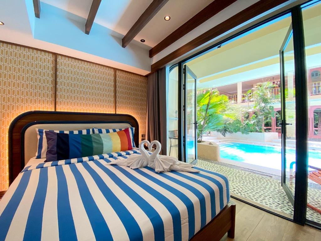 Postel nebo postele na pokoji v ubytování Miami Hotel Bangkok