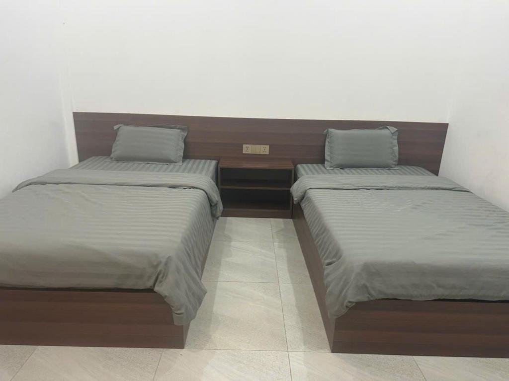 Postel nebo postele na pokoji v ubytování Khách sạn grace hotel dakmil