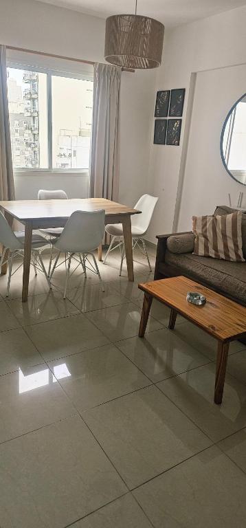 a living room with a couch and a table at Palermo Apart 3 in Buenos Aires