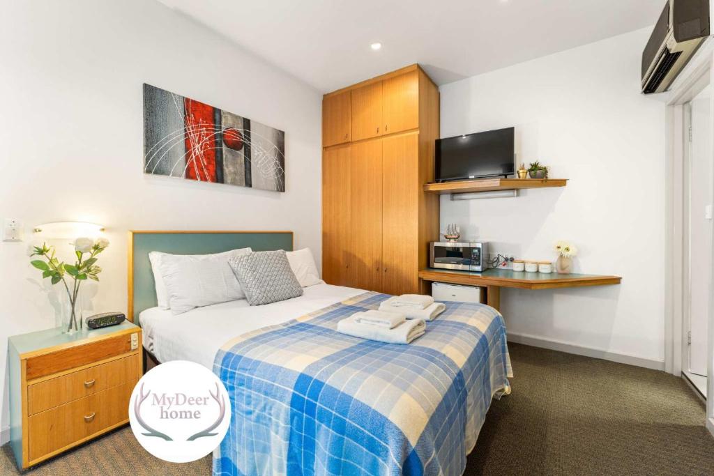 Ένα ή περισσότερα κρεβάτια σε δωμάτιο στο The Hidden Gem - Adelaide CBD