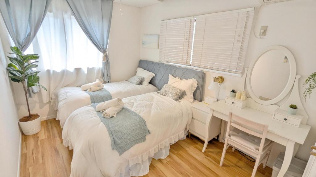 Giường trong phòng chung tại Mybound Homestay Zushi