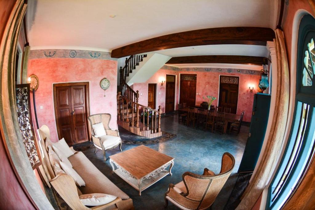 an overhead view of a living room with a table and chairs at Sagala Boutique Hotel in Bandarawela