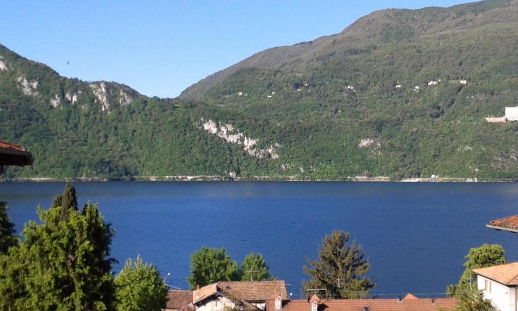 a view of a lake in front of a mountain at B&B Le Colombine in Abbadia Lariana