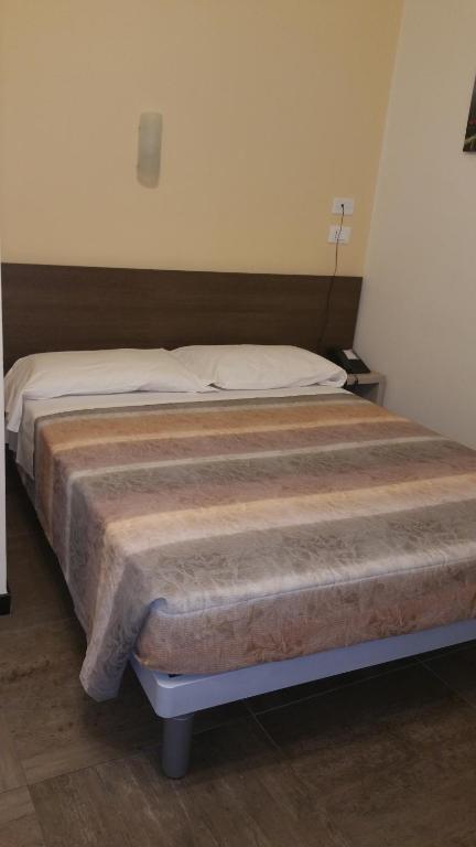 Postel nebo postele na pokoji v ubytování Hotel Tommaseo