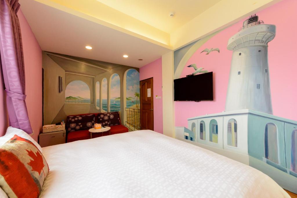 Love in Hengchun B&B tesisinde bir odada yatak veya yataklar
