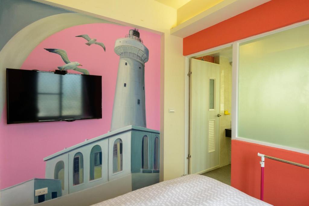 Love in Hengchun B&B tesisinde bir odada yatak veya yataklar