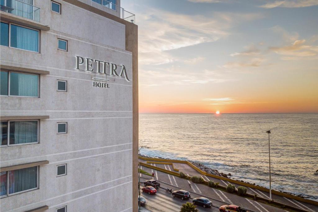 a rendering of the exterior of a hotel overlooking the ocean at Wyndham Garden Antofagasta Pettra in Antofagasta
