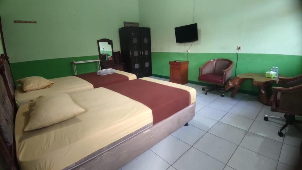 Ένα ή περισσότερα κρεβάτια σε δωμάτιο στο Hotel Antik