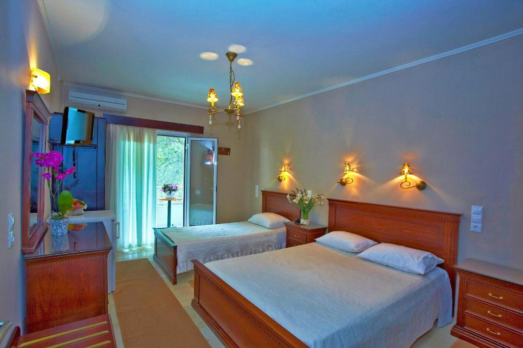 Posteľ alebo postele v izbe v ubytovaní Hotel Maistrali