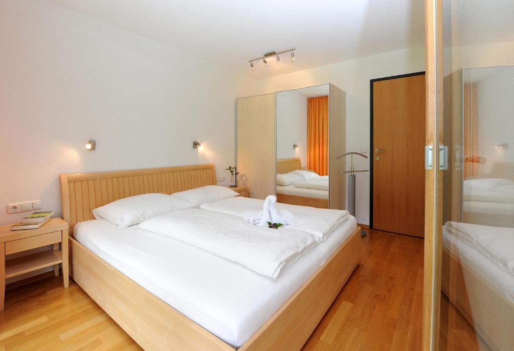 Postel nebo postele na pokoji v ubytování Apartments Susanne