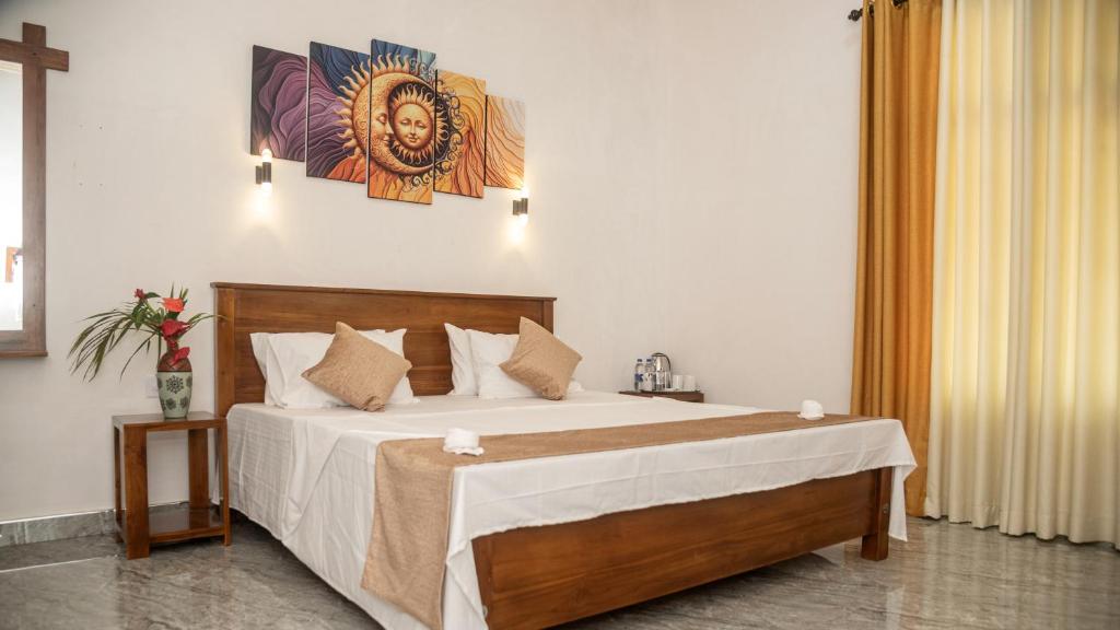 Ένα ή περισσότερα κρεβάτια σε δωμάτιο στο Sigiriya Agrarian Haven