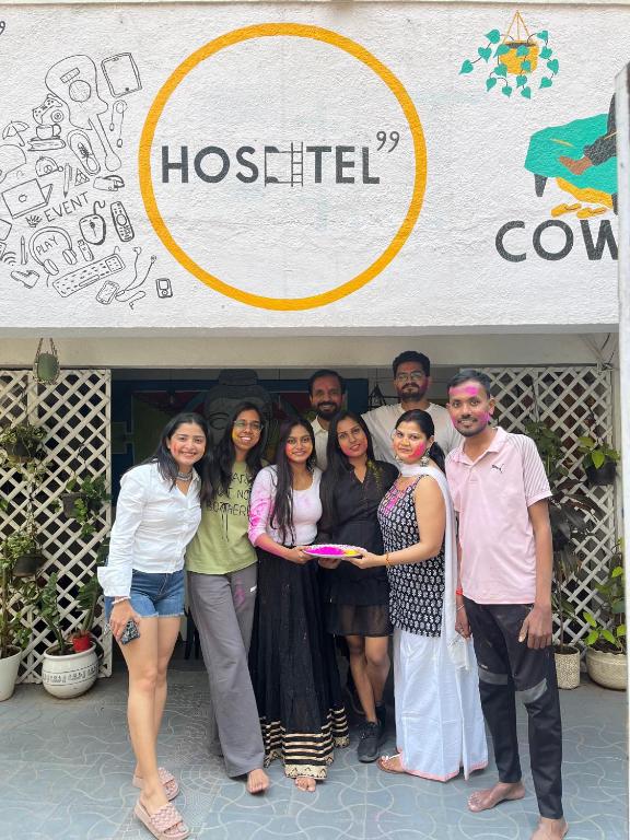a group of people standing in front of a store at HOSHTEL99 - PRIME - Stay, Cowork & Connect in Pune