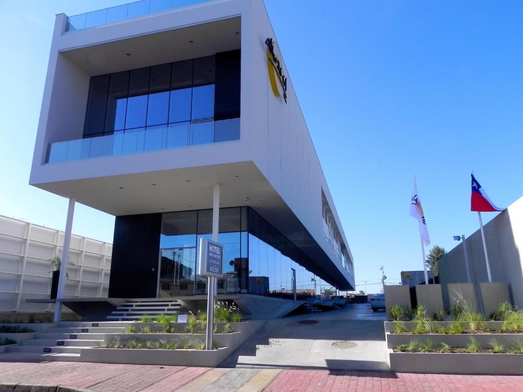 a large building with stairs in front of it at Alto del Sol Latorre Mejillones in Mejillones