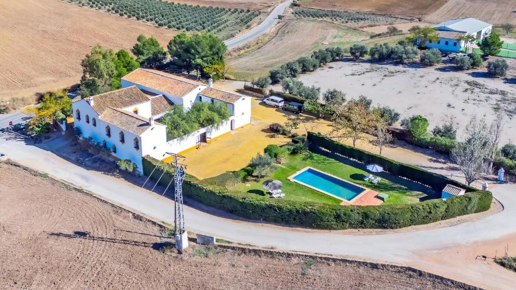 an aerial view of a house with a yard at Cubo's Casa Rural Cortijo del Puntal in Teba
