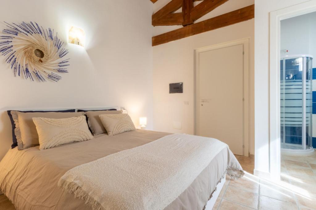 Ένα ή περισσότερα κρεβάτια σε δωμάτιο στο La Margherita Guesthouse, Nebida seaview