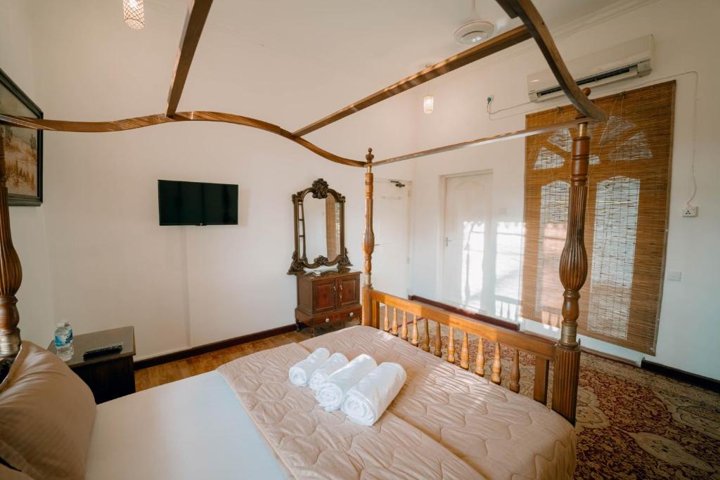 Postel nebo postele na pokoji v ubytování SkyPort Villa Negombo